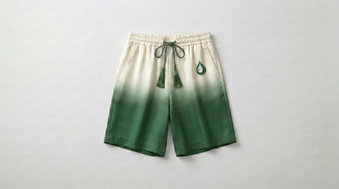 Tevilah Olive Branch cream-to-olive ombré silk shorts with tasseled drawstring — front